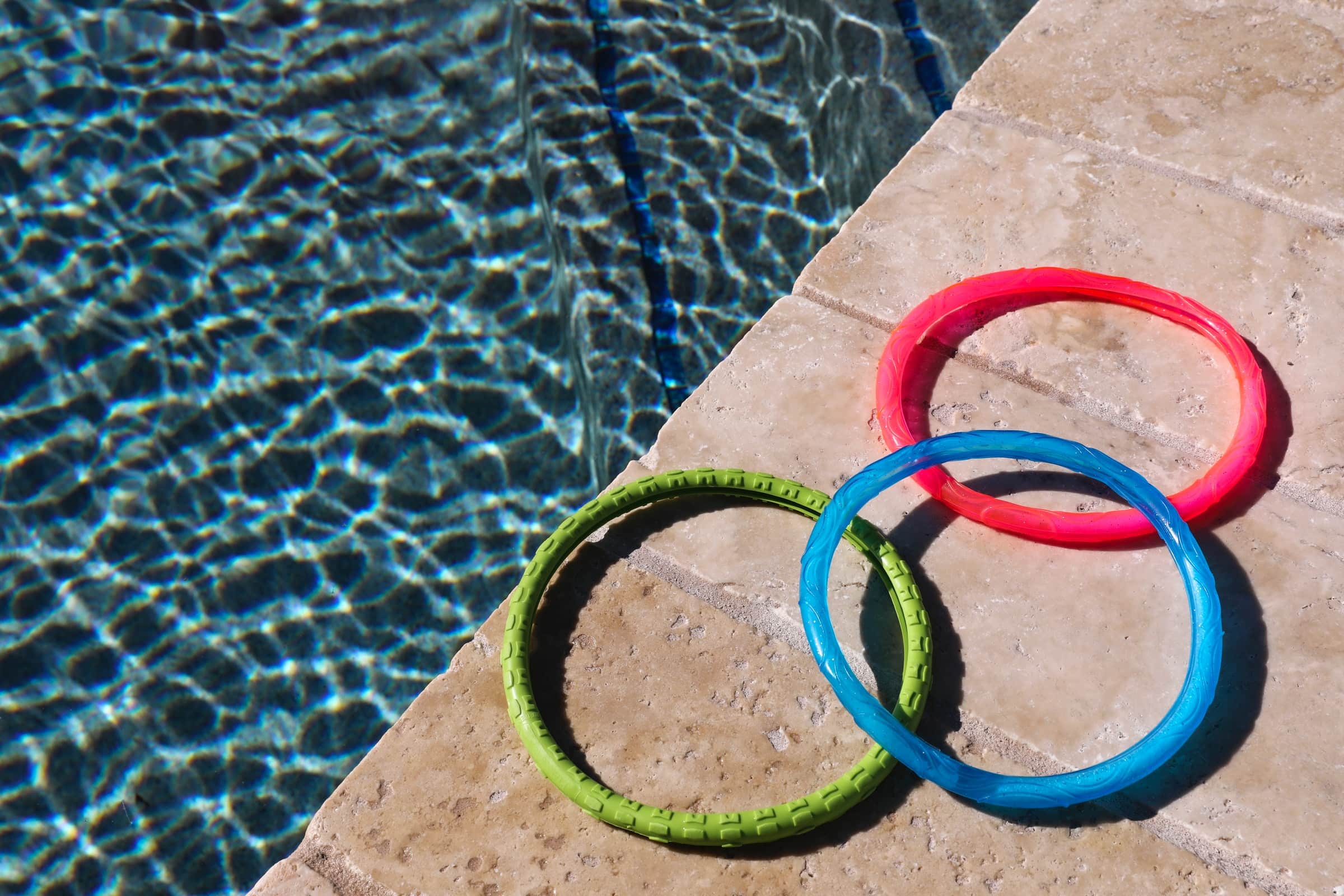 Diving rings next to a pool, overlapping each other like Venn diagrams.