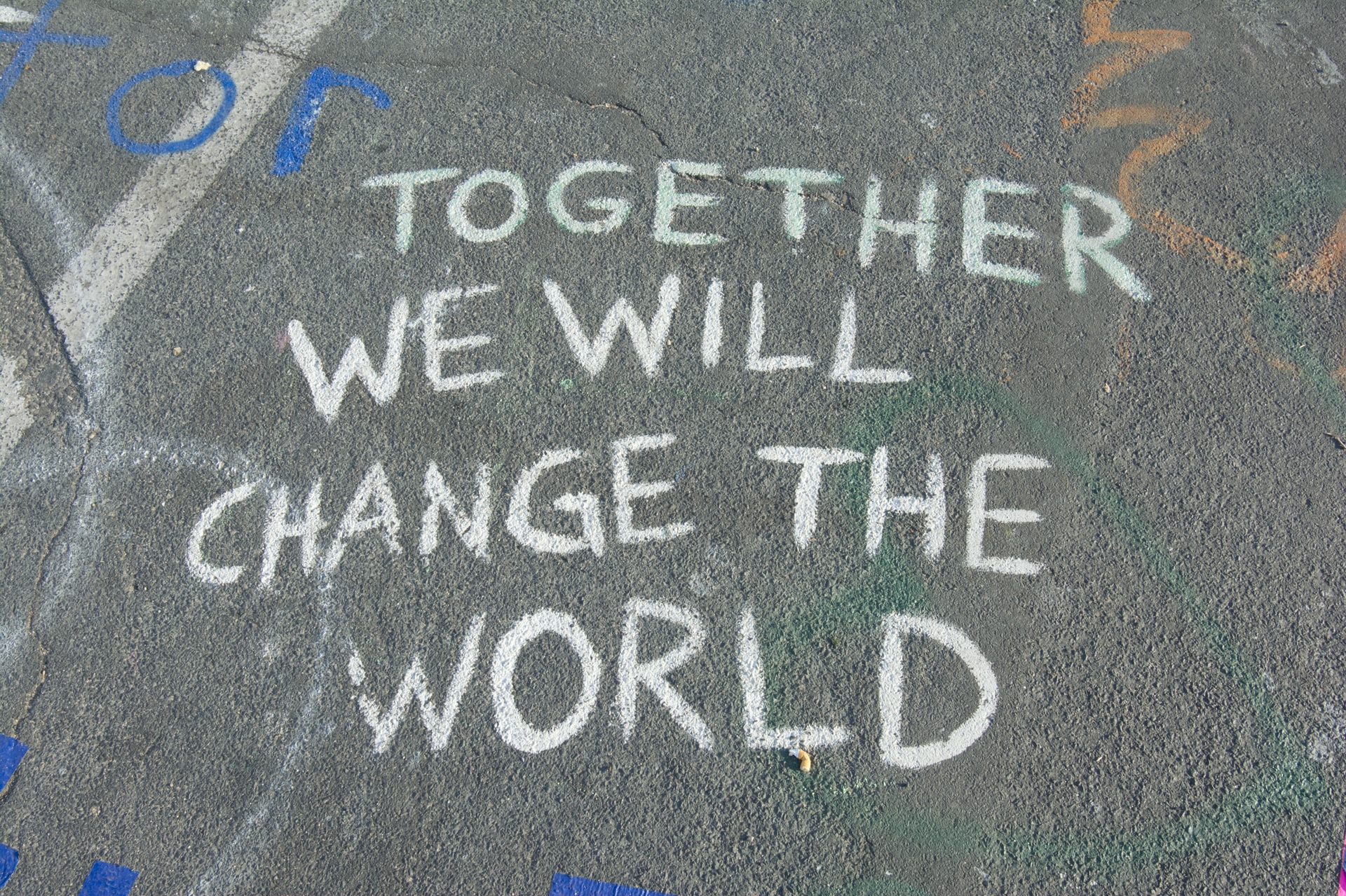The image shows a writing that says together we will change the world.