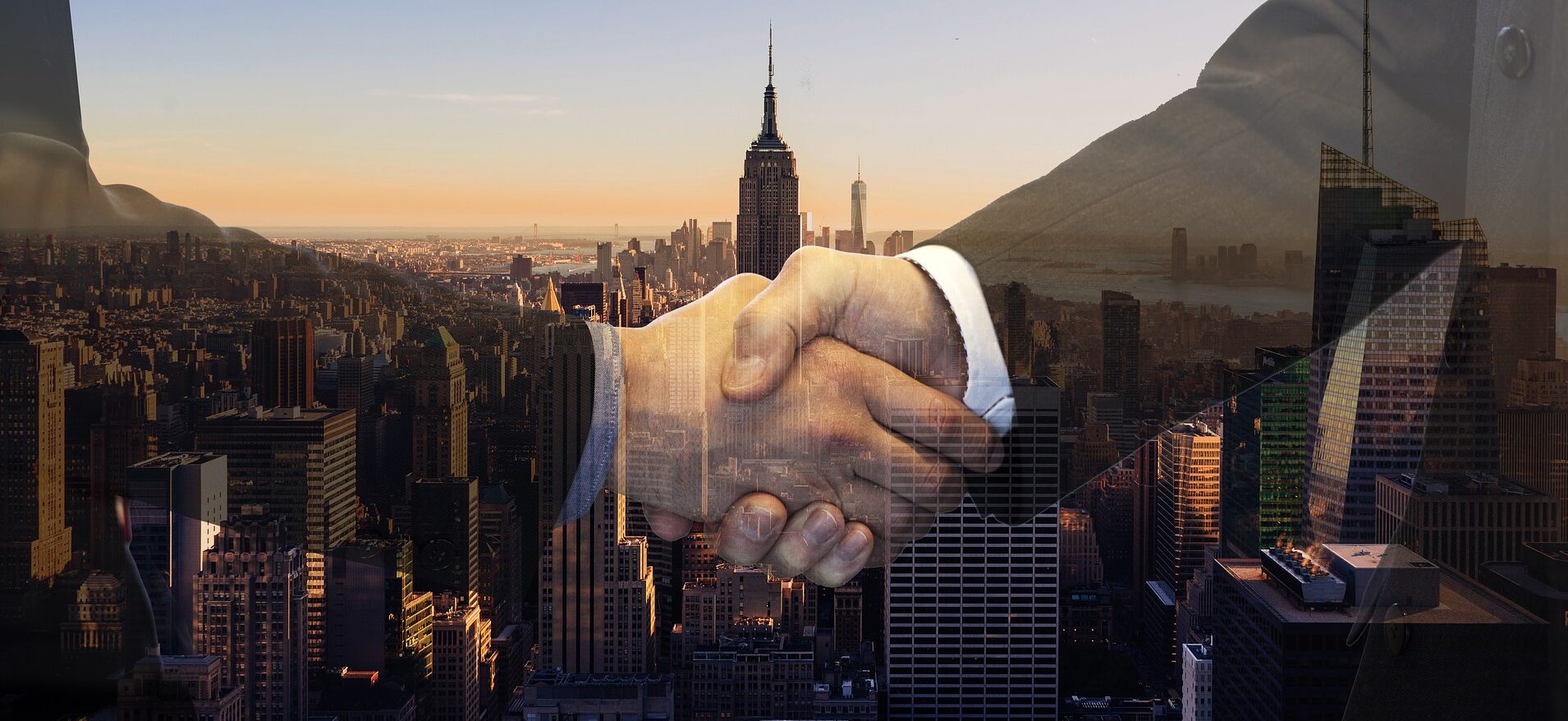 The image represents two people shaking hands for their jjoint business plan